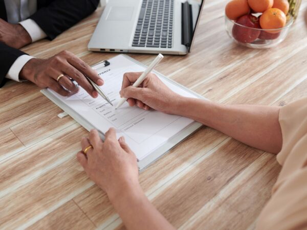 Woman Filling Property Insurance Form