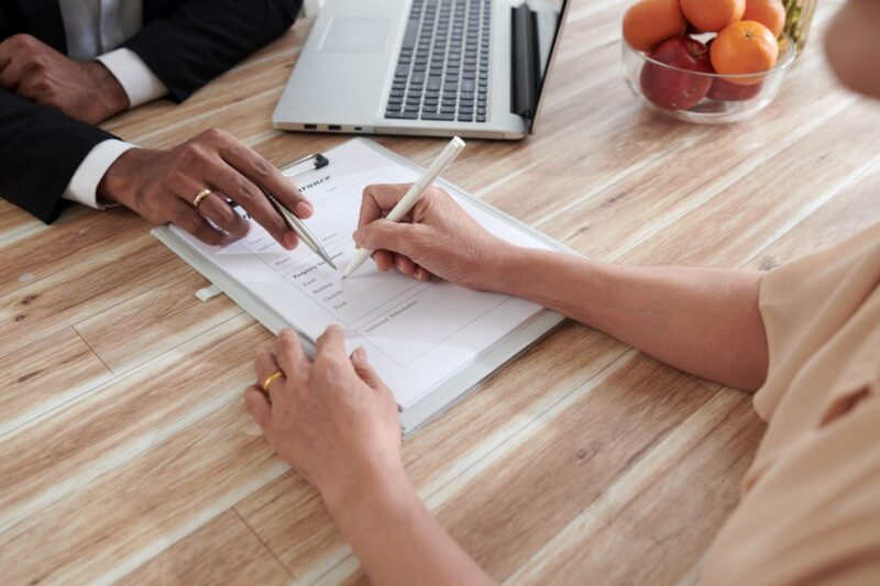 Woman Filling Property Insurance Form